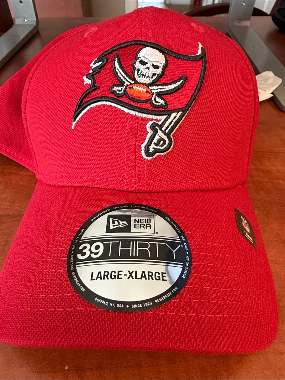 New Era Red Flex-Fit Hat with Embroidered Skull-and-Swords Logo